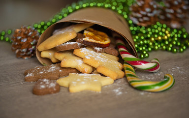 Tasty Homemade Christmas Cookies with Festive Decoration on a Wooden Background.
