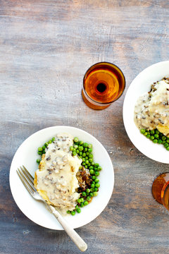 Shiitake Mushroom Wild Rice Shepard's Pie served with Peas and Gravy.