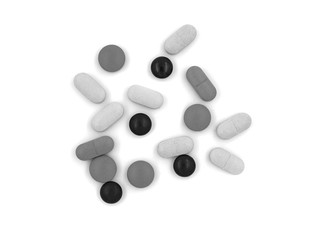 Black and white tablets (pills) on a white background