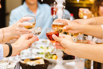 A group of people drink alcohol in a restaurant