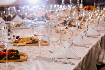 Table setting for many people, wine glasses
