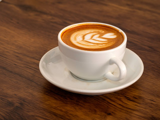 White coffee cup on wood table, coffee time