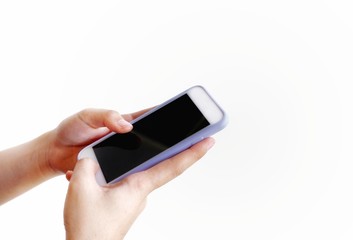 Close up young female hands is using mobile phone on isolated white background