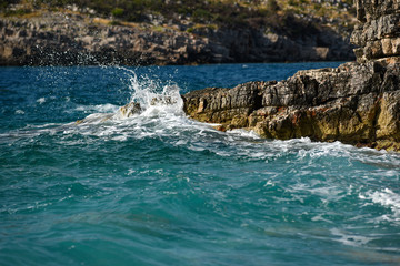 Rocky coast of the aristocratic sea in Montenegro with turquoise water.