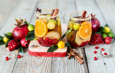 Sangria with pomegranate, pear, orange, kumquat and spices.