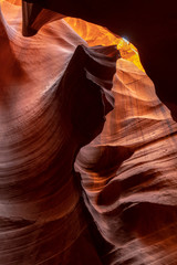 Spiral orange red rock protuding from sandstone wall in Upper antelope, Arizona