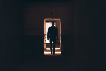 Man walk through the Black Corridor