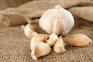 Onions on a brown rug background.