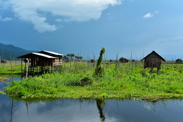Fototapeta na wymiar Traditional, wooden cabins at Inle Lake. Remains of the native, beautiful Burma (Myanmar).
