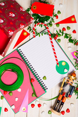 The Nutcracker and Christmas accessories on rustic white woody background