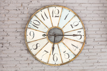 Fototapeta na wymiar Retro clock showing six fifteen on the wall
