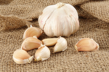 Onions on a brown rug background.