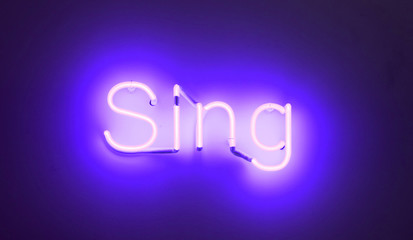 Neon sign - Shining over a white wall