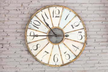 Fototapeta na wymiar Retro clock showing ten forty five on the wall
