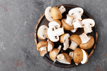 Fresh mushruums on wooden board, top view. Champignon fungi © Sea Wave