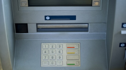 Close-up of automated teller machine, buttons on ATM, secure money withdrawing