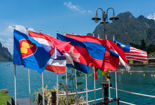 View of national flags of Southeast Asia countries. Brunei Darussalam, Myanmar Burma, Cambodia, Indonesia, Laos, Malaysia, Philippines, Singapore, Thailand, Vietnam, East Timor. Nature background