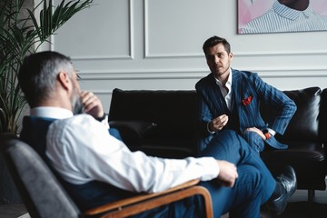 Business executives discussing work, developing strategy for online business, explaining sharing ideas, preparing presentation, having brainstorming session at office