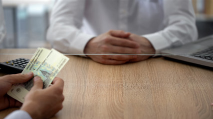 Client making russian rubles deposit in bank, savings and personal spending