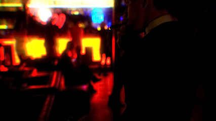 Fototapeta na wymiar Young businessman smoking cigar at nightclub party, enjoying evening alone