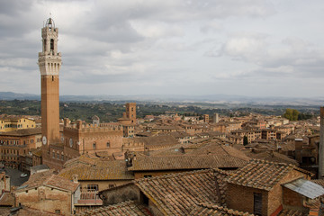 Fototapeta na wymiar Siena, panoramic view. Panoramic view of Siena with main tower of the city in foreground 