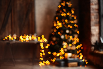 Candles And Garland Lighting Indoors. Xmas Tree decorated By Lights. Christmas background