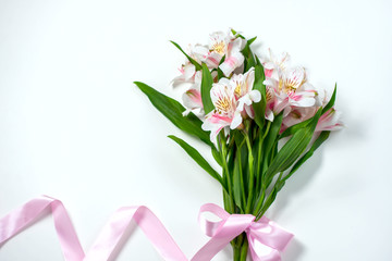 Bouquet of flowers alstroemeria with gift box on a white background.
