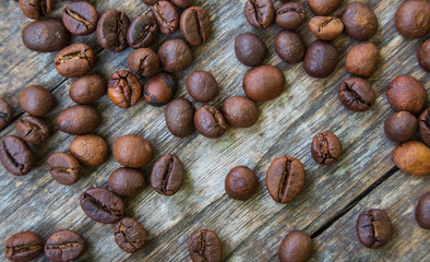Coffee beans on old wood background