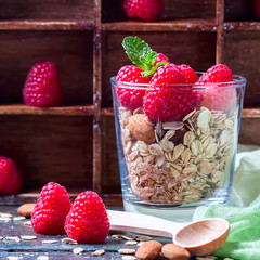 Healthy breakfast. Granola with honey, yogurt and fresh berries raspberry in a glass.
