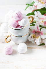 Delicious white and pink marshmallows in cup.
