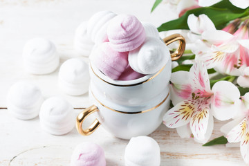 Delicious white and pink marshmallows in cup.