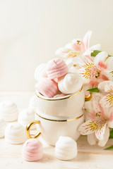 Delicious white and pink marshmallows in cup.
