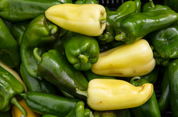 Close up fresh green and yellow bell peppers