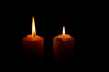 Two candlelights in the dark backgroud