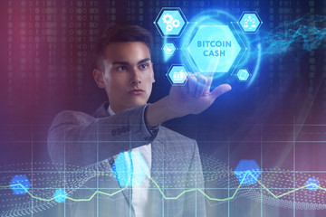 The concept of business, technology, the Internet and the network. A young entrepreneur working on a virtual screen of the future and sees the inscription: bitcoin cash
