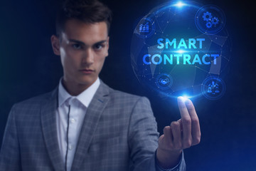 The concept of business, technology, the Internet and the network. A young entrepreneur working on a virtual screen of the future and sees the inscription: smart contract