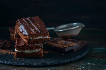 homemade chocolate brownies on dark background