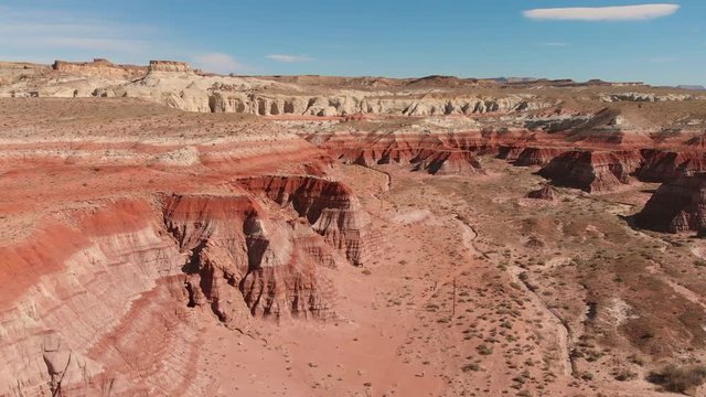 Drone aerial of parked cars and an RV near Paria Rimrocks Toadstool Hoodoos in the Grand Staircase-Escalante National Monument