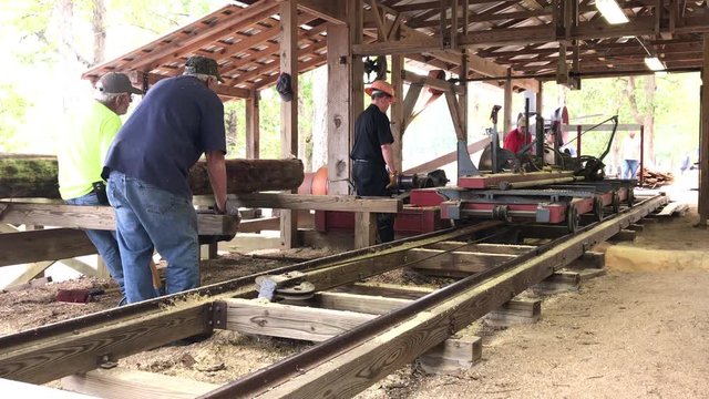 Old fashion working lumber mill demonstration