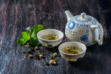 Chinese tea set, green tea and fresh mint.