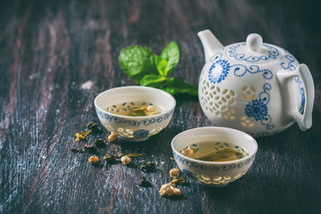 Chinese tea set, green tea and fresh mint.