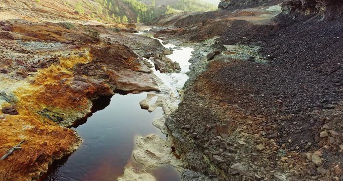 Rio Tinto river at Nerva besides the Rio Tinto mines. This river is very polluted and acid because of the extraction of tons of copper, zinc, gold, silver,lead and other metals since year 3000 BC to