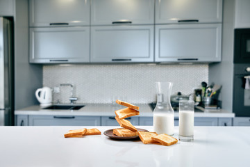 Flying toasts for breakfast and a glass of milk drink. Levitation food and healthy breakfast...