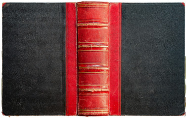 Old open book cover with black textured paper boards and cracked embossed red leather spine with...