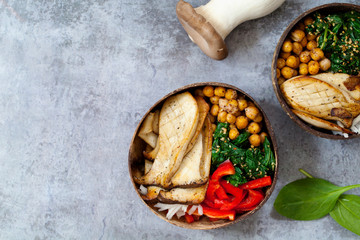 Vegan Buddha bowl with king oyster mushroom, chickpeas, spinach and red pepper