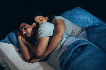 Couple sleeping in bed. The sleeping couple relax in the bed. night time