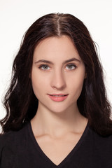 Fototapeta premium Attractive woman with black t-shirt isolated on a over white background