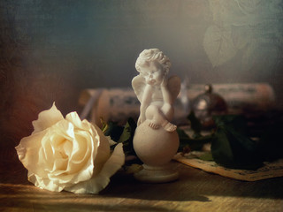 still life vintage with angel and rose