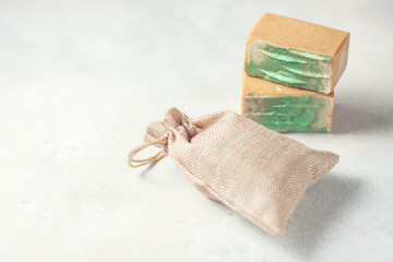 Organic handmade soap and a linen sack. Place for text.