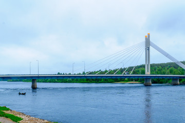 Fototapeta na wymiar Lumberjacks Candle Bridge and the Kemijoki River in Rovaniemi